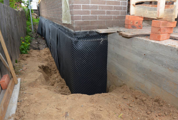 Happy homeowners after waterproofing job in Berrien Center